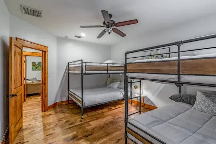 Ideal for families and groups, this bedroom offers generous sleeping arrangements.