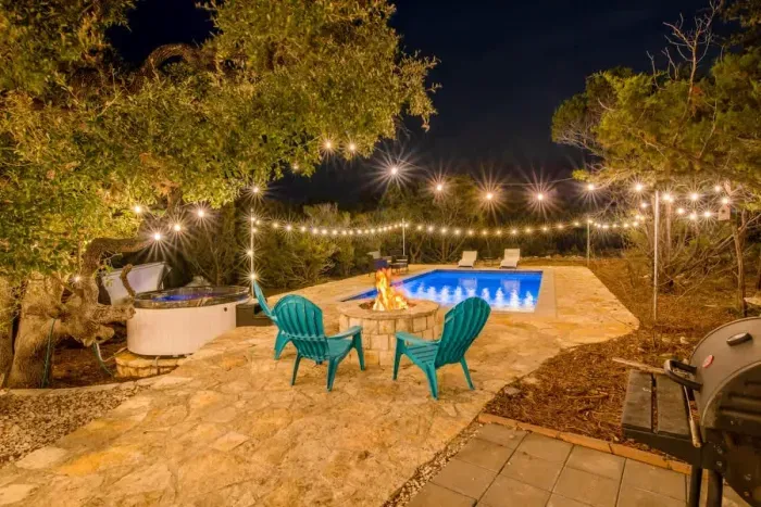 Unwind in your private backyard retreat, complete with a serene pool and lush landscaping.