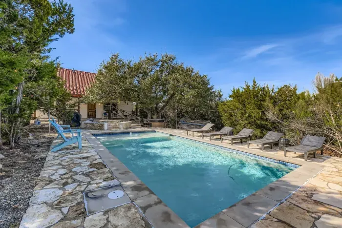 Patio seating overlooking the pool.