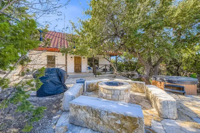 Spacious backyard with stone features.