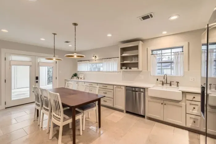 Step into this bright and airy kitchen and dining space, perfect for enjoying home-cooked meals or gathering with loved ones. Featuring sleek quartz countertops, modern stainless-steel appliances, and ample cabinet storage, this fully equipped kitche
