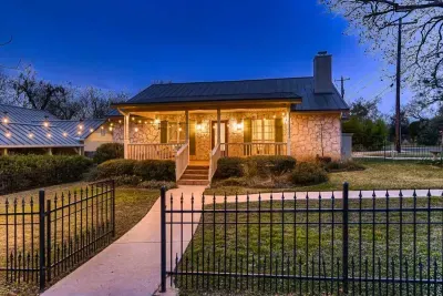 Timeless and elegant home with classic architectural details and a lush front lawn.