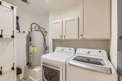 Convenient laundry area with a washer and dryer, making packing a breeze.