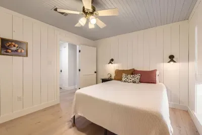 Featuring a beautifully dressed queen-size bed and soft lighting, this room is ideal for couples seeking a romantic retreat.