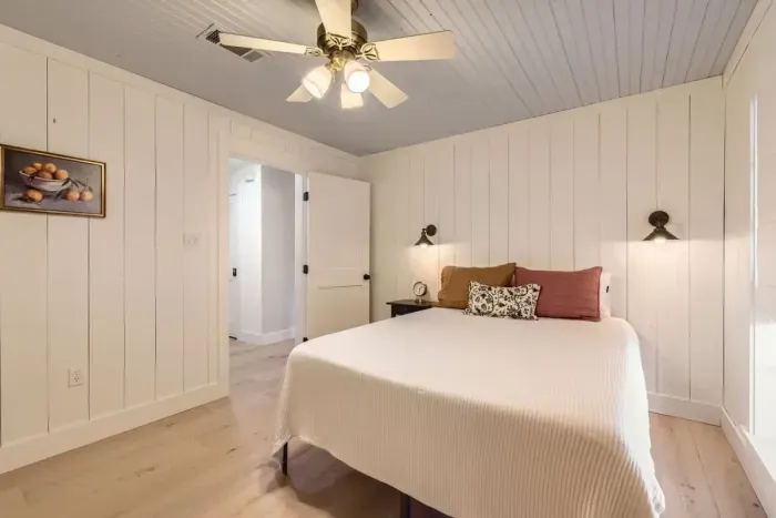 Featuring a beautifully dressed queen-size bed and soft lighting, this room is ideal for couples seeking a romantic retreat.