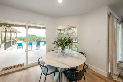 An additional dining area view with chic natural lighting.