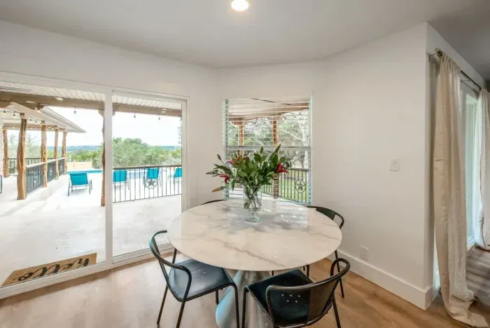 An additional dining area view with chic natural lighting.