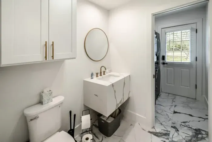 Effortless elegance in this beautifully designed half bathroom.