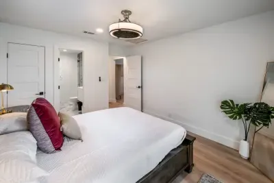 A sophisticated primary bedroom with serene ambiance.