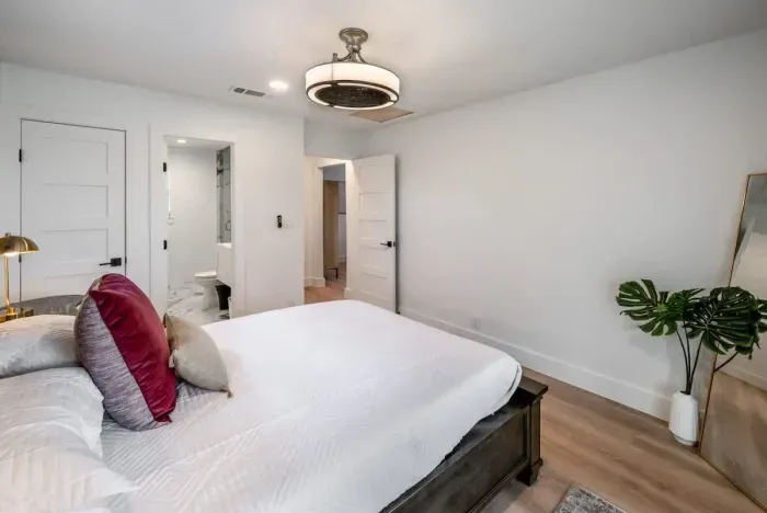 A sophisticated primary bedroom with serene ambiance.