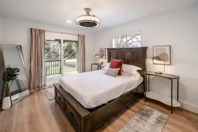 A serene primary bedroom offering refined comfort and tranquility.