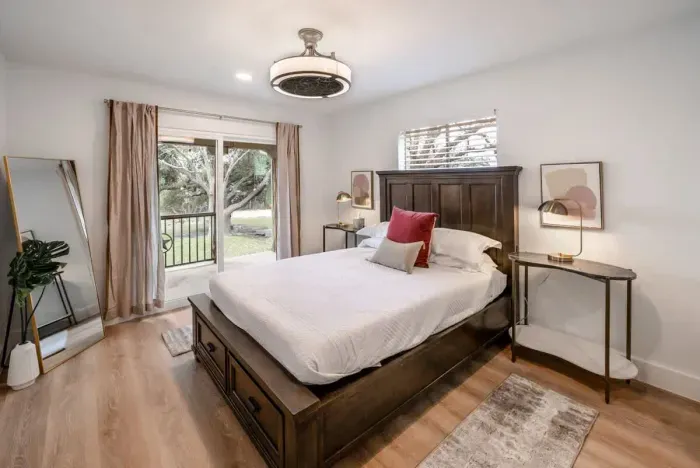 A serene primary bedroom offering refined comfort and tranquility.