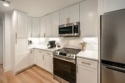 A fully equipped modern kitchen featuring upscale appliances and polished design.