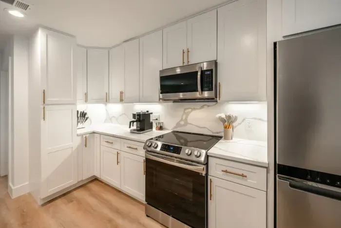 A fully equipped modern kitchen featuring upscale appliances and polished design.