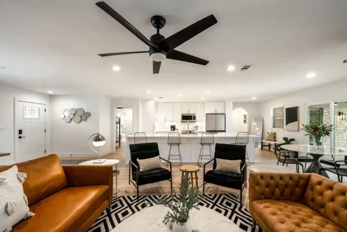 A second view of the warm inviting living room curated for upscale comfort.