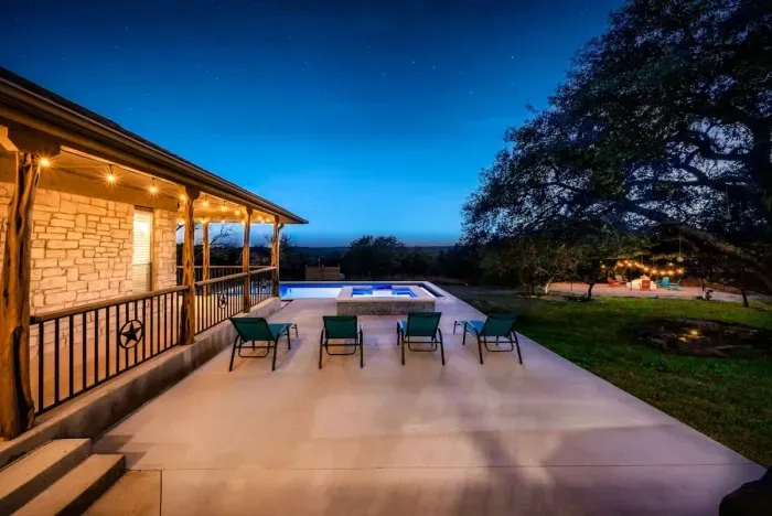 A picture-perfect pool glowing at dusk with breathtaking resort ambiance.