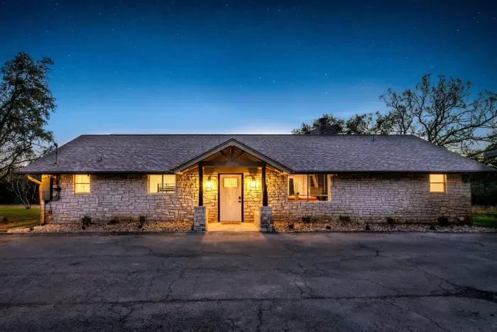 A twilight façade exuding charm and inviting elegance.