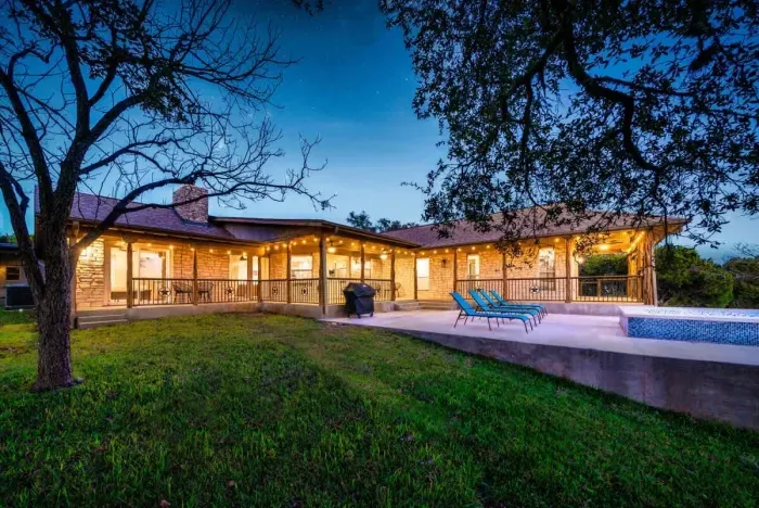 A beautifully lit backyard oasis perfect for evening gatherings.