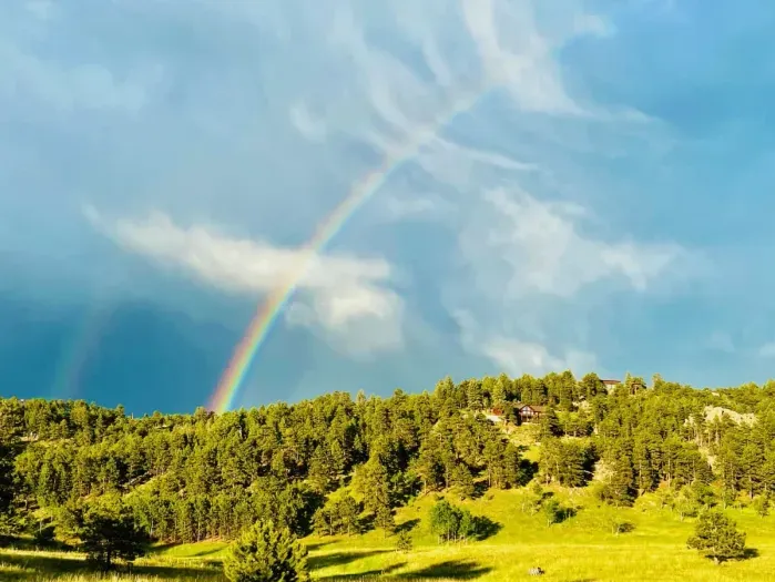Catch sight of an epic rainbow stretching across the sky, adding a splash of color to the landscape. This stunning natural display creates a magical atmosphere, perfect for a memorable moment.