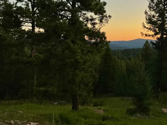 Experience breathtaking mountain sunsets from the driveway, where the vibrant colors of the sky meet the stunning mountain backdrop. The peaceful view creates a perfect setting to unwind and enjoy nature’s beauty.