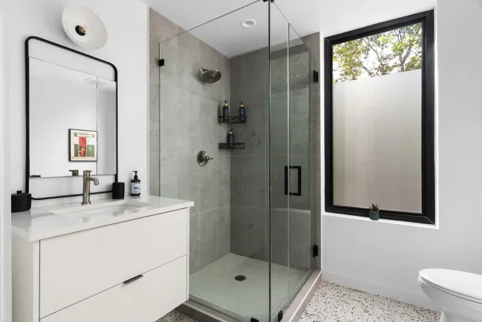 Unwind in our spacious bathroom with modern amenities and a touch of luxury