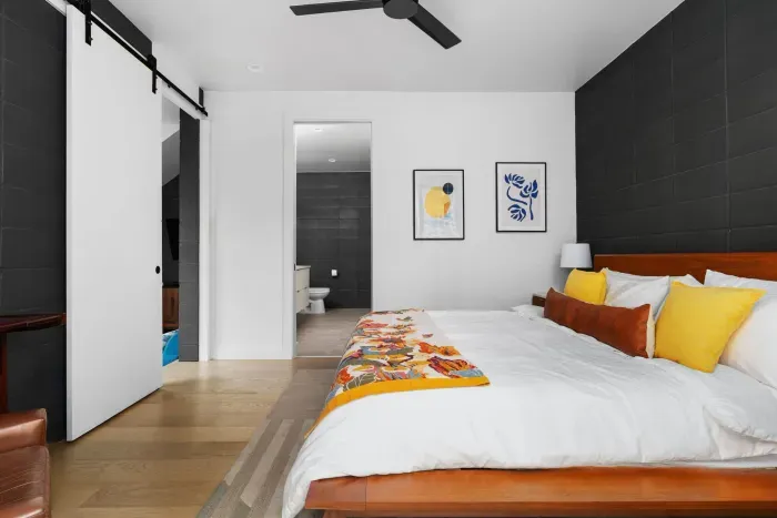 Modern bedroom with minimalist design and high-quality bedding.