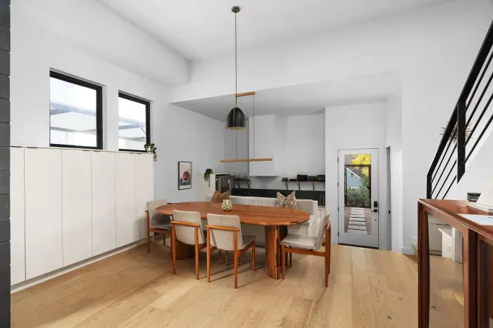 Sleek and modern dining area with minimalist decor and a welcoming atmosphere.