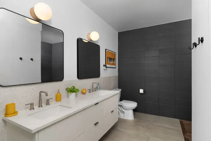 Modern bathroom with sleek fixtures, a spacious shower, and high-end amenities.