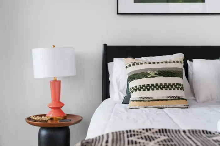 A cozy queen bed adorned with boho-chic decor creates a warm, inviting space to unwind after a day of adventures.