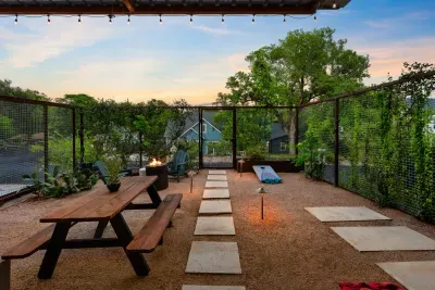Well-manicured backyard with a variety of flowers and plants, creating a colorful and tranquil retreat.