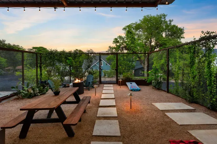 Well-manicured backyard with a variety of flowers and plants, creating a colorful and tranquil retreat.