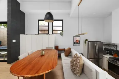 The open-concept dining area flows seamlessly from the kitchen, making group meals a breeze.