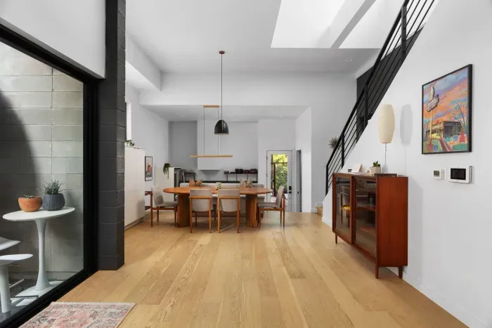 Open-concept living room with seamless flow to the kitchen and dining areas.