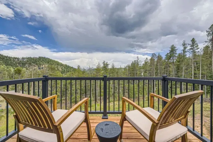 4. Top-level deck designed to soak in the Colorado sun and breathtaking views. Perfect for relaxing, sunbathing, or enjoying a meal outdoors, this deck offers a serene escape with stunning mountain vistas. Ideal for those who want to embrace nature