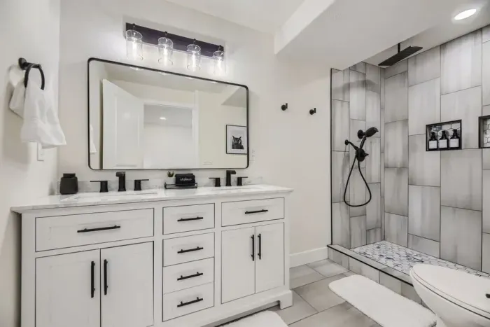 Fresh and stylish bathroom with a large vanity and natural light.