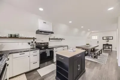 5. Functional and beautiful, this kitchen comes fully equipped with cookware, utensils, and small appliances.