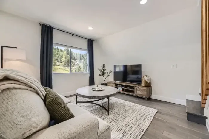 Equipped with a large TV, cozy seating, and space for everyone.