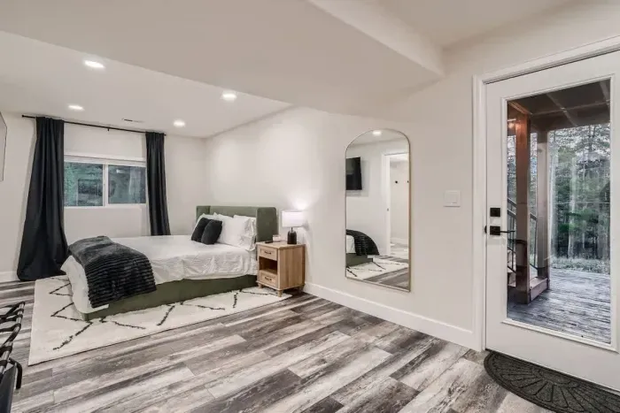 Elegant bedroom featuring sophisticated décor, luxurious bedding, and a serene ambiance. With carefully selected furnishings and a calming color palette, this space offers both comfort and style. Perfect for relaxation, it creates a tranquil retreat