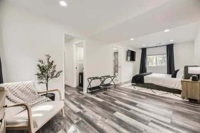 Luxurious bedroom with premium linens and a reading nook for ultimate relaxation.