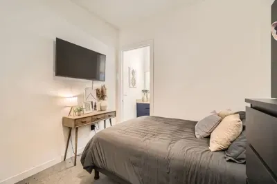 This bedroom features a plush queen bed, soft linens, and calming decor to ensure a restful night’s sleep.