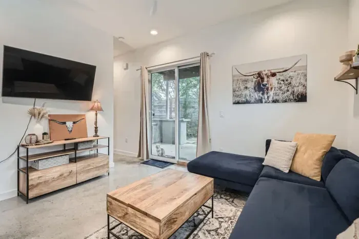 Equipped with a large TV, cozy seating, and space for everyone.