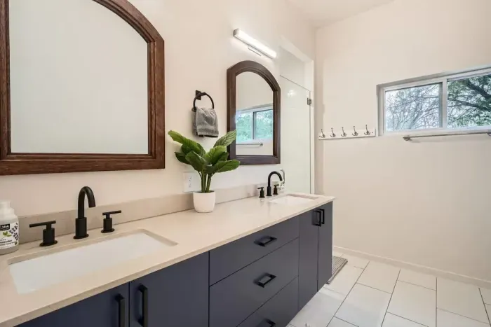 Bright and airy bathroom with plenty of counter space and stylish decor.