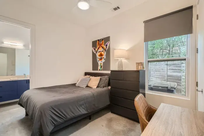 Peaceful second bedroom with a plush queen-sized bed and soft linens for a restful night’s sleep.