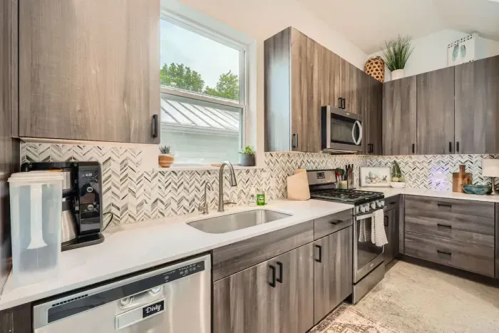 Sleek and modern design meets functionality in this fully stocked kitchen.