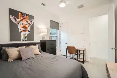 Functional and stylish bedroom with a desk for remote work or study.