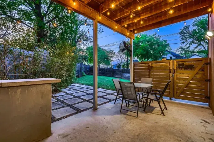 The perfect patio setting with a cozy evening glow.