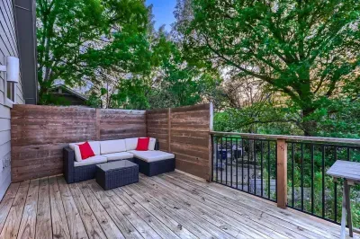 Private patio with lush plants and a calming atmosphere, perfect for unwinding after a long day.