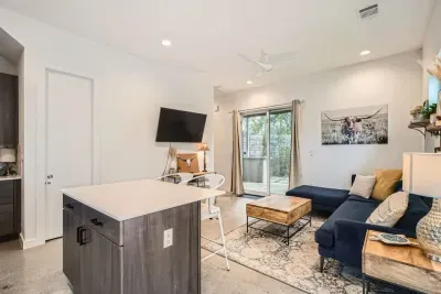 Open-concept living room with seamless flow to the kitchen and dining areas.