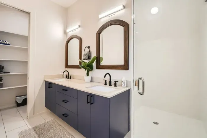 Unwind in our spacious bathroom with modern amenities and a touch of luxury