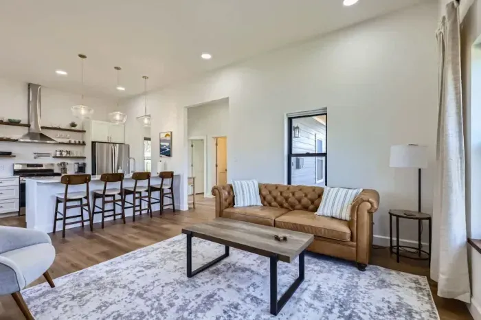 Cozy living room with plush seating and a large TV for movie nights or relaxing afternoons.